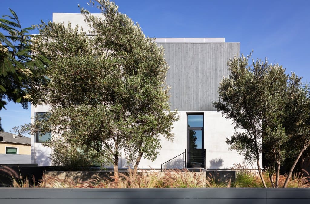 The exterior side view of a modern new home in California, our three wall Skybox is visible on the roof for easy access to the roof deck.