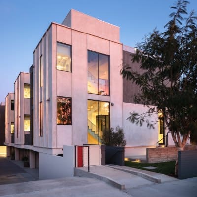 The exterior of a modern new home in Culver City, LA that uses three wall Skybox to access their roof decks.