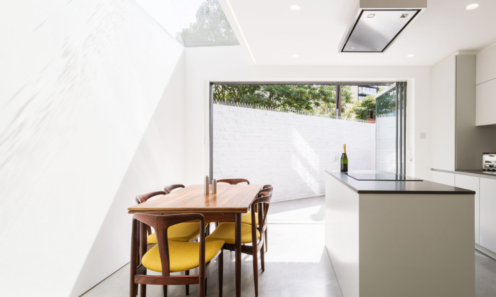 A light filled kitchen with a large roof window. Inspirational glass skylight image